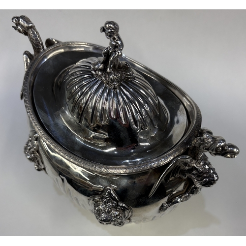 689 - A 19th Century silver figural tea caddy / sugar box and cover with cast dragon handles and embossed ... 