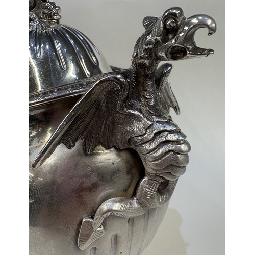 689 - A 19th Century silver figural tea caddy / sugar box and cover with cast dragon handles and embossed ... 