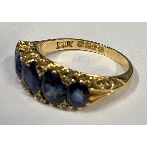 797 - A good Antique sapphire five-stone ring with diamond chips in 18 carat gold setting. Approx. ring si... 