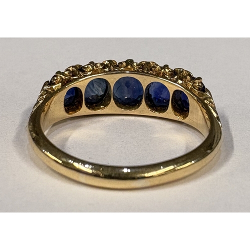 797 - A good Antique sapphire five-stone ring with diamond chips in 18 carat gold setting. Approx. ring si... 