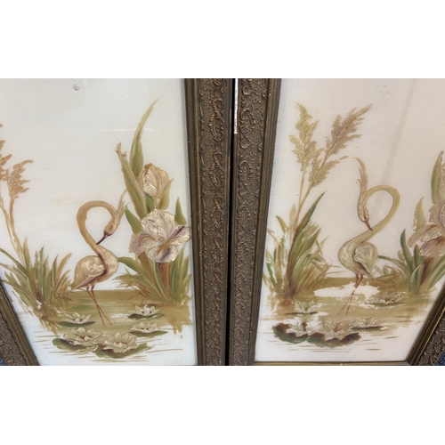 147 - A pair of gilt framed paintings on glass depicting cranes. Approx. 30 cm x 60 cm (ss). Est. £20 - £3... 