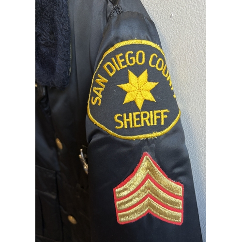 154 - A reproduction US Sheriff's Department uniform. Est. £10 - £20.