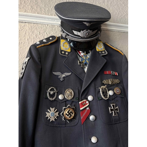 157 - A reproduction WW2 Luftwaffe Officer's uniform together with cap. Est. £20 - £30.