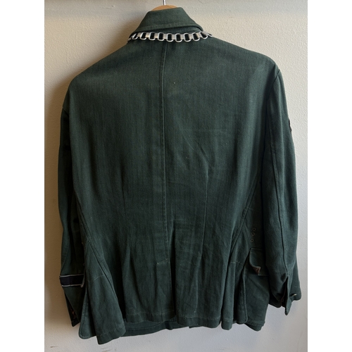 158 - A reproduction WW2 German Feldgendarmerie uniform together with a helmet and gas mask case. Est. £20... 