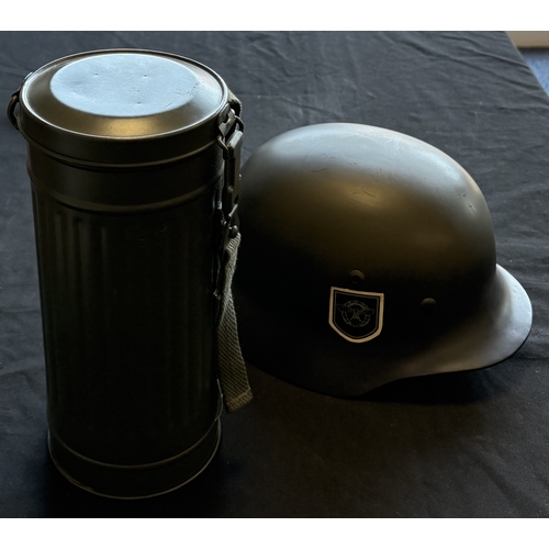 158 - A reproduction WW2 German Feldgendarmerie uniform together with a helmet and gas mask case. Est. £20... 