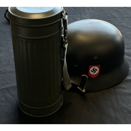 158 - A reproduction WW2 German Feldgendarmerie uniform together with a helmet and gas mask case. Est. £20... 