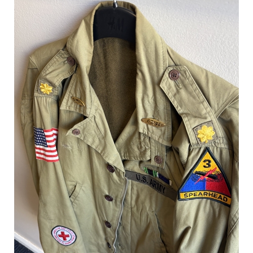 167 - A reproduction US Army battle dress jacket together with US Army shirt and trousers. Est. £10 - £20.