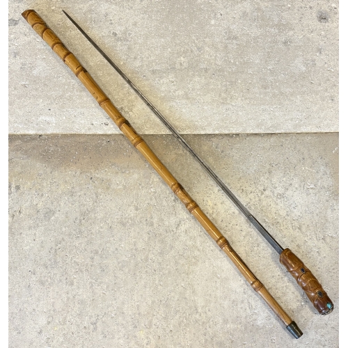 181 - A 20th Century bamboo sword stick with jewelled pommel. Est. £50 - £80.