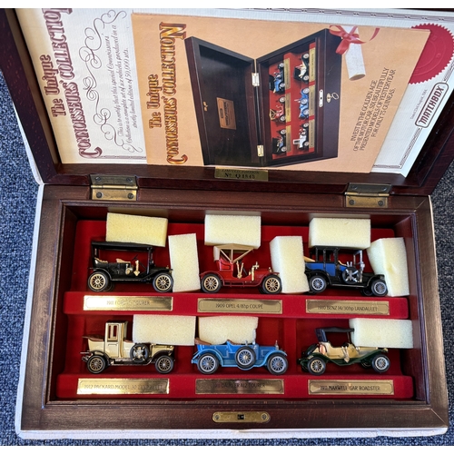 233 - Two framed and glazed display cabinets containing various 'Corgi' Morris Minor diecast model vehicle... 