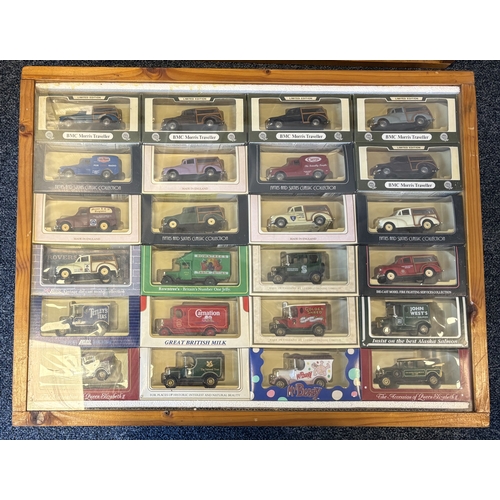 233 - Two framed and glazed display cabinets containing various 'Corgi' Morris Minor diecast model vehicle... 