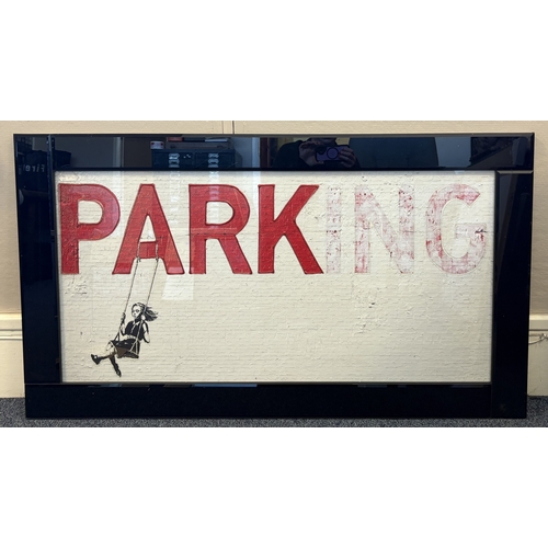 89 - A framed print depicting Banksy's 'Parking' with tactile raised glazing. Approx. 98 cm x 49 cm (ss).... 
