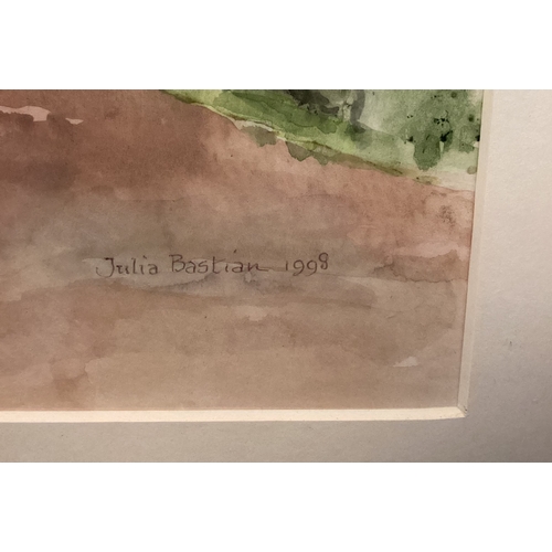 99 - JULIA BASTIAN: (British, 20th Century): A framed and glazed watercolour depicting the village of Bro... 