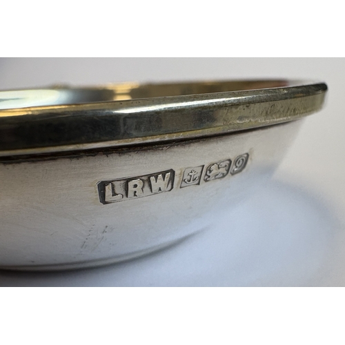 106 - A small silver wine taster with textured body. Birmingham. By L&W. Approx. 39 grams. Est. £20 - £30.