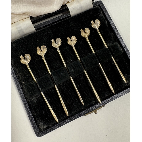 111 - A set of six silver gilt sandwich picks with cockerel finials. Birmingham. Approx. 7 grams. Est. £80... 
