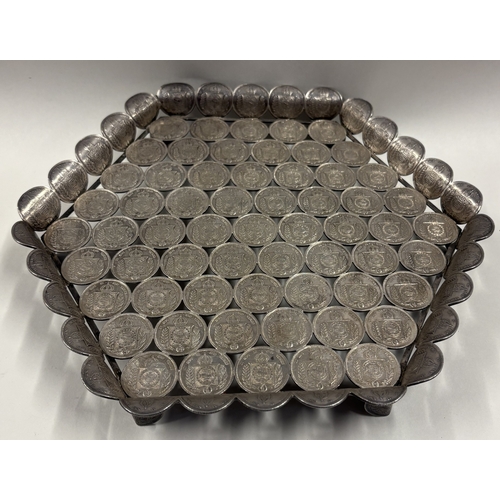 128 - A rare and unusual 19th Century silver salver cast with coins. Approx. 636 grams. Est. £600 - £800.