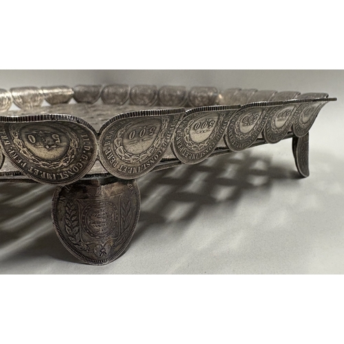 128 - A rare and unusual 19th Century silver salver cast with coins. Approx. 636 grams. Est. £600 - £800.
