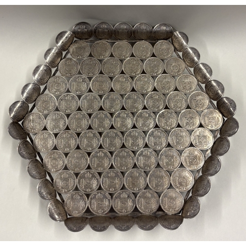 128 - A rare and unusual 19th Century silver salver cast with coins. Approx. 636 grams. Est. £600 - £800.