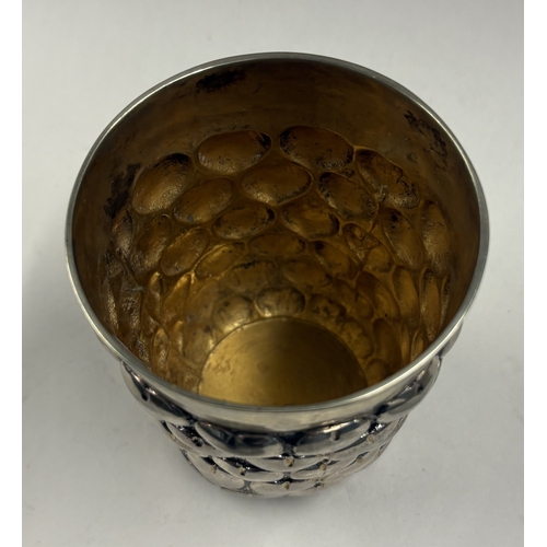 141 - A fine quality German silver beaker chased with heart decoration. Approx. 224 grams. Est. £300 - £40... 