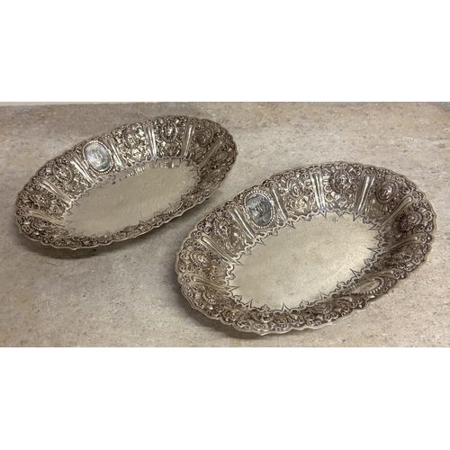 151 - GLASGOW: A fine and rare pair of Scottish silver Cellini pattern fruit dishes embossed with figures.... 