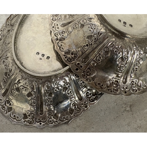 151 - GLASGOW: A fine and rare pair of Scottish silver Cellini pattern fruit dishes embossed with figures.... 