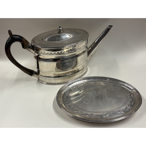 159 - An 18th Century George III silver teapot with bright-cut decoration on stand. London 1791. By Robert... 