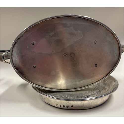 159 - An 18th Century George III silver teapot with bright-cut decoration on stand. London 1791. By Robert... 