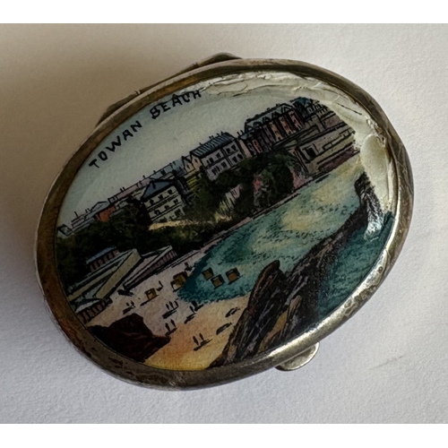 16 - An oval silver and enamelled box with hinged cover. Approx. 11 grams. Est. £10 - £20.