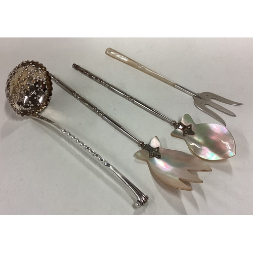 162 - A good silver Onslow pattern sifter spoon together with a pickle fork etc. Approx. 47 grams. Est. £2... 