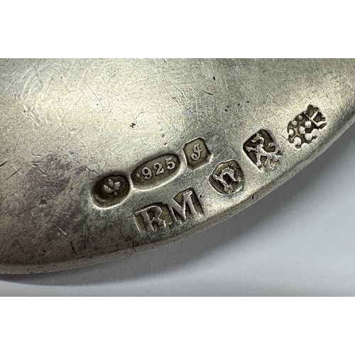 17 - A Victorian silver caddy spoon with embossed scene to centre. Bearing English import marks. Sheffiel... 