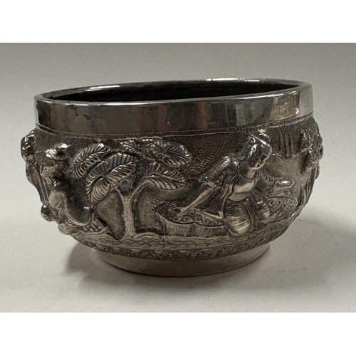 175 - A late 19th Century Burmese silver bowl three-dimensional decoration. Approx. 132 grams. Est. £120 -... 
