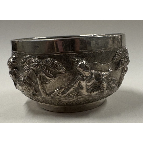 175 - A late 19th Century Burmese silver bowl three-dimensional decoration. Approx. 132 grams. Est. £120 -... 