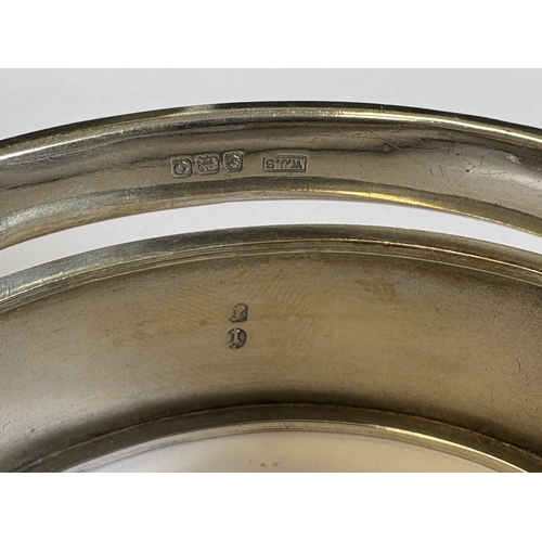 178 - Two engraved silver bangles. Approx. 34 grams. Est. £20 - £30.