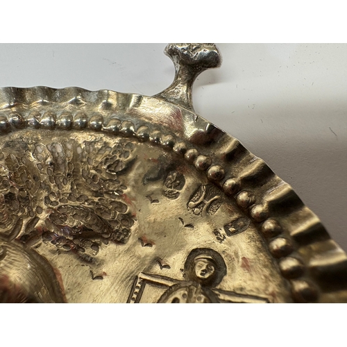 20 - An Antique Continental silver caddy spoon with cast squirrel to handle and embossed scene to bowl. A... 