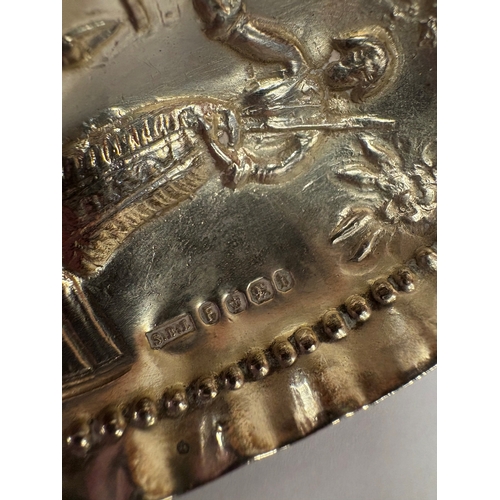 21 - An Antique Continental novelty silver caddy spoon with embossed scene to bowl of woman and grouse. A... 