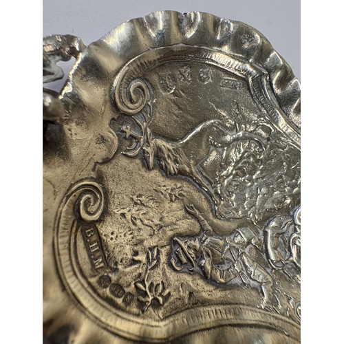 22 - A rare Antique Continental silver caddy spoon cast with man with dog shooting stag. Approx. 31 grams... 