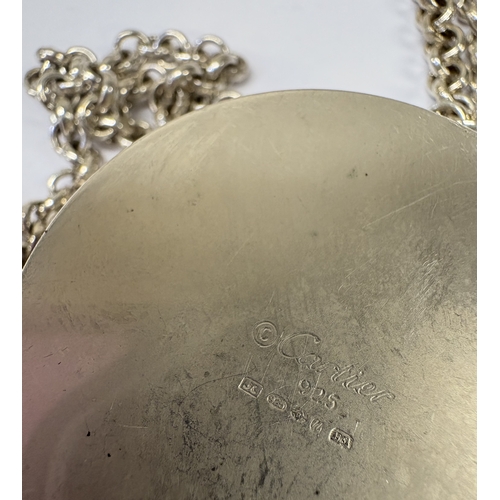 25 - CARTIER: A silver snuff box with screw-top cover on suspension chain. Marked to base. Approx. 84 gra... 