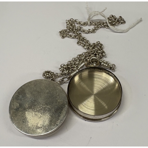 25 - CARTIER: A silver snuff box with screw-top cover on suspension chain. Marked to base. Approx. 84 gra... 