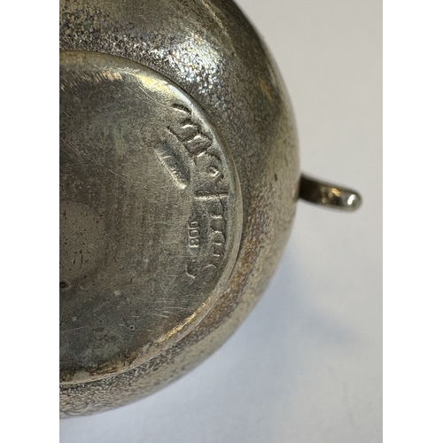 27 - A miniature heavy Continental silver baluster-shaped water jug. Approx. 47 grams. Est. £40 - £60.