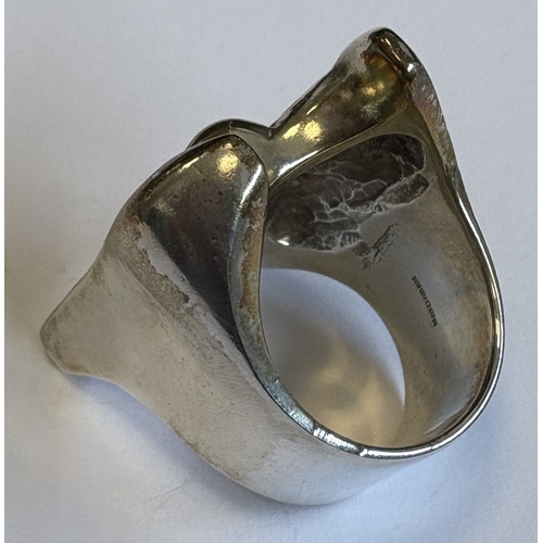 29 - A heavy cast silver ring with textured decoration. London. Approx. 54 grams. Est. £30 - £50.
