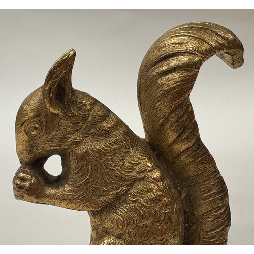 33 - A cast silver gilt figure of a squirrel. Approx. 110 grams. Est. £150 - £200.