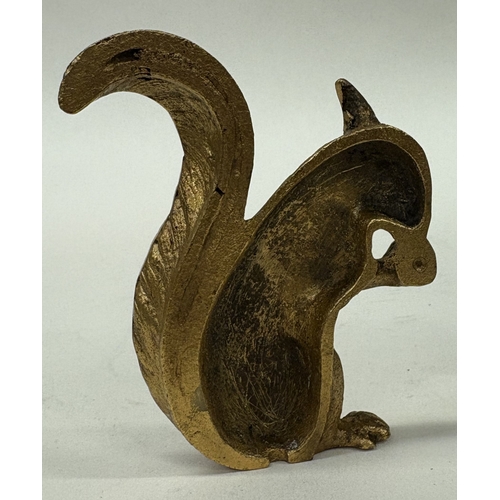 33 - A cast silver gilt figure of a squirrel. Approx. 110 grams. Est. £150 - £200.
