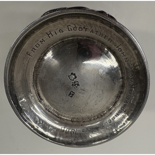 36 - A large 18th Century embossed silver pint mug. London 1746. Approx. 362 grams. Est. £300 - £400.