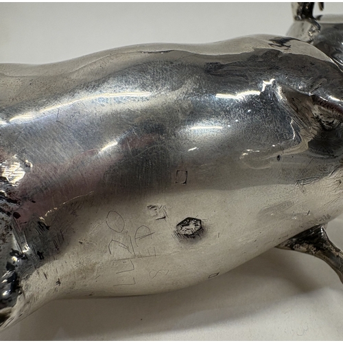 37 - An attractive Antique Dutch silver cow creamer. Marked to base. Approx. 166 grams. Est. £400 - £600.