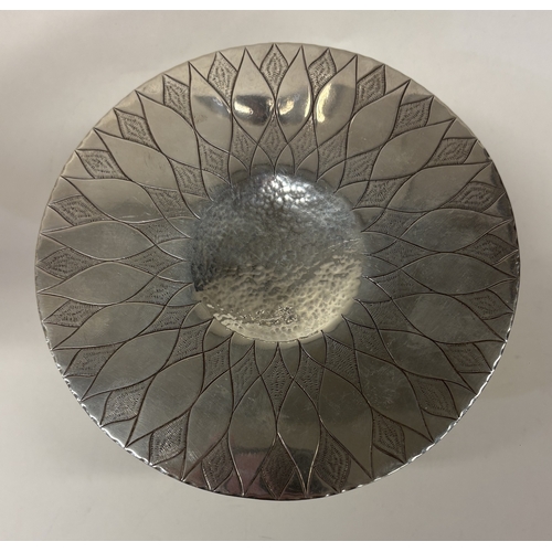 38 - A Modernistic silver tazza with unusual bright-cut decoration to top. London 1977. By Kenneth Bagule... 