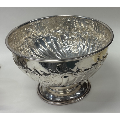 41 - A fine quality silver presentation bowl with embossed floral decoration. Birmingham 1912. By William... 