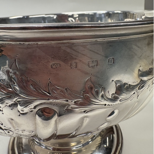 41 - A fine quality silver presentation bowl with embossed floral decoration. Birmingham 1912. By William... 
