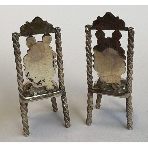 5 - A good pair of Continental silver toy chairs. Approx. 16 grams. Est. £20 - £30.