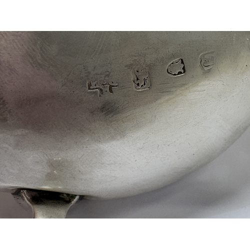 6 - An 18th Century George III silver sauceboat on feet. London 1764. Approx. 86 grams. Est. £80 - £120.