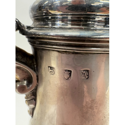 86 - A George III silver coffee pot with crested decoration. London 1756. By Richard Gurney & Thomas Cook... 