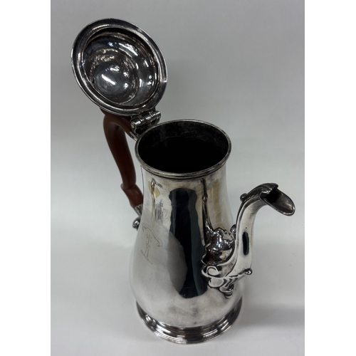 86 - A George III silver coffee pot with crested decoration. London 1756. By Richard Gurney & Thomas Cook... 